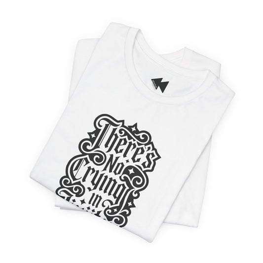 A folded white short-sleeve T-shirt with a black gothic-style graphic text print reading 'There's No Crying in JiuJitsu' on the front, displayed against a clean white background.