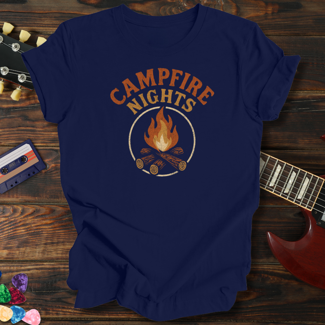 Navy blue t-shirt with 'Campfire Nights' design on a wooden surface with guitar and cassette tape.