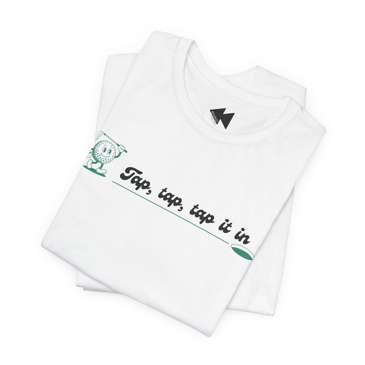 A folded white t-shirt with a green and black graphic on the chest that reads 'Tap, tap, tap it in' next to a cartoon character, shown on a clean white background.