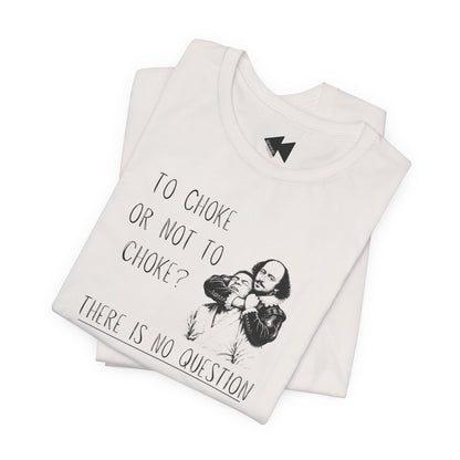 A folded off white graphic T-shirt on a plain white background. The shirt features a black printed illustration of Shakespeare and the text 'TO CHOKE OR NOT TO CHOKE? THERE IS NO QUESTION'.