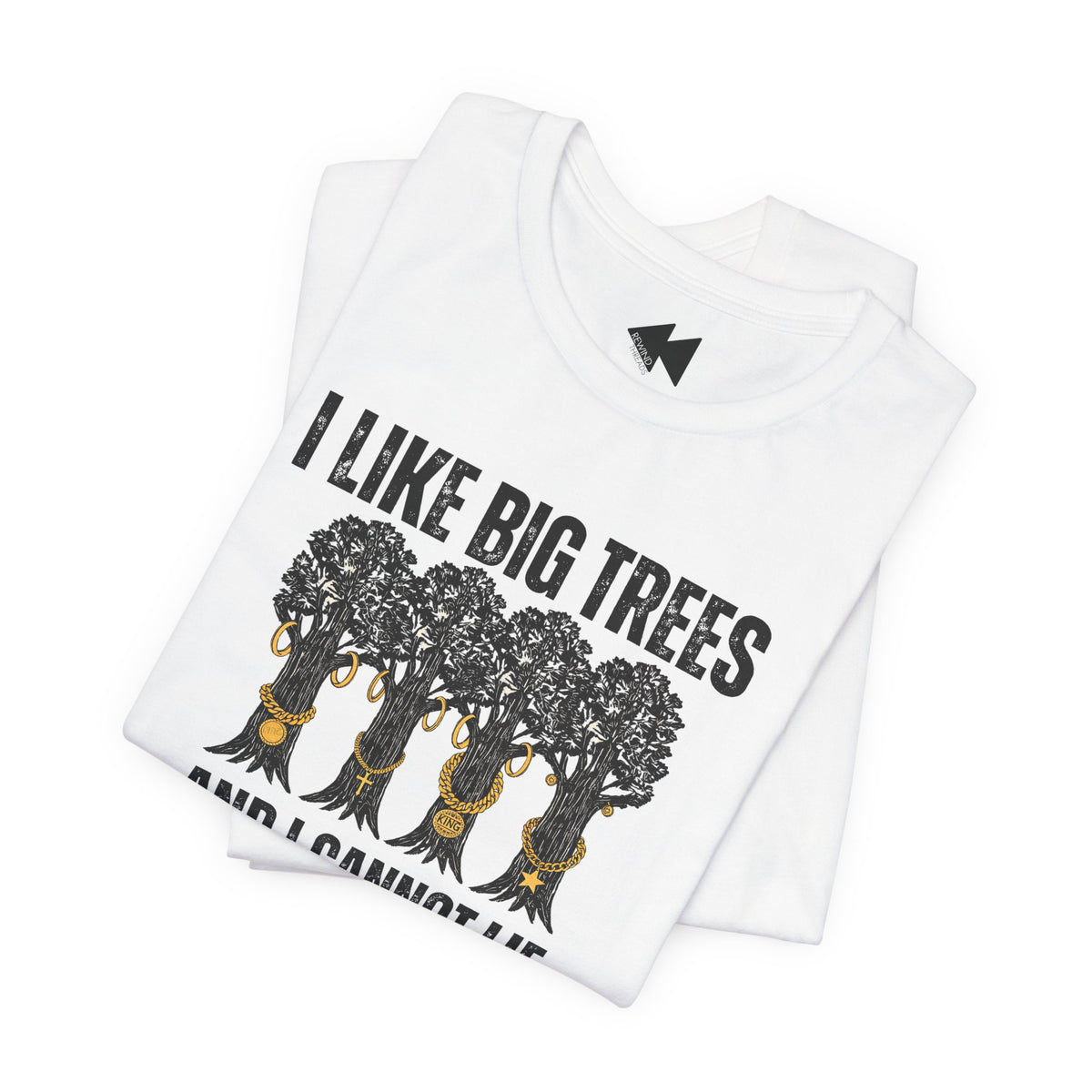 A folded white short-sleeve T-shirt with a black graphic print of five trees wearing gold necklaces beneath the text 'I LIKE BIG TREES' and 'AND I CANNOT LIE' in black, shown on a plain white background.
