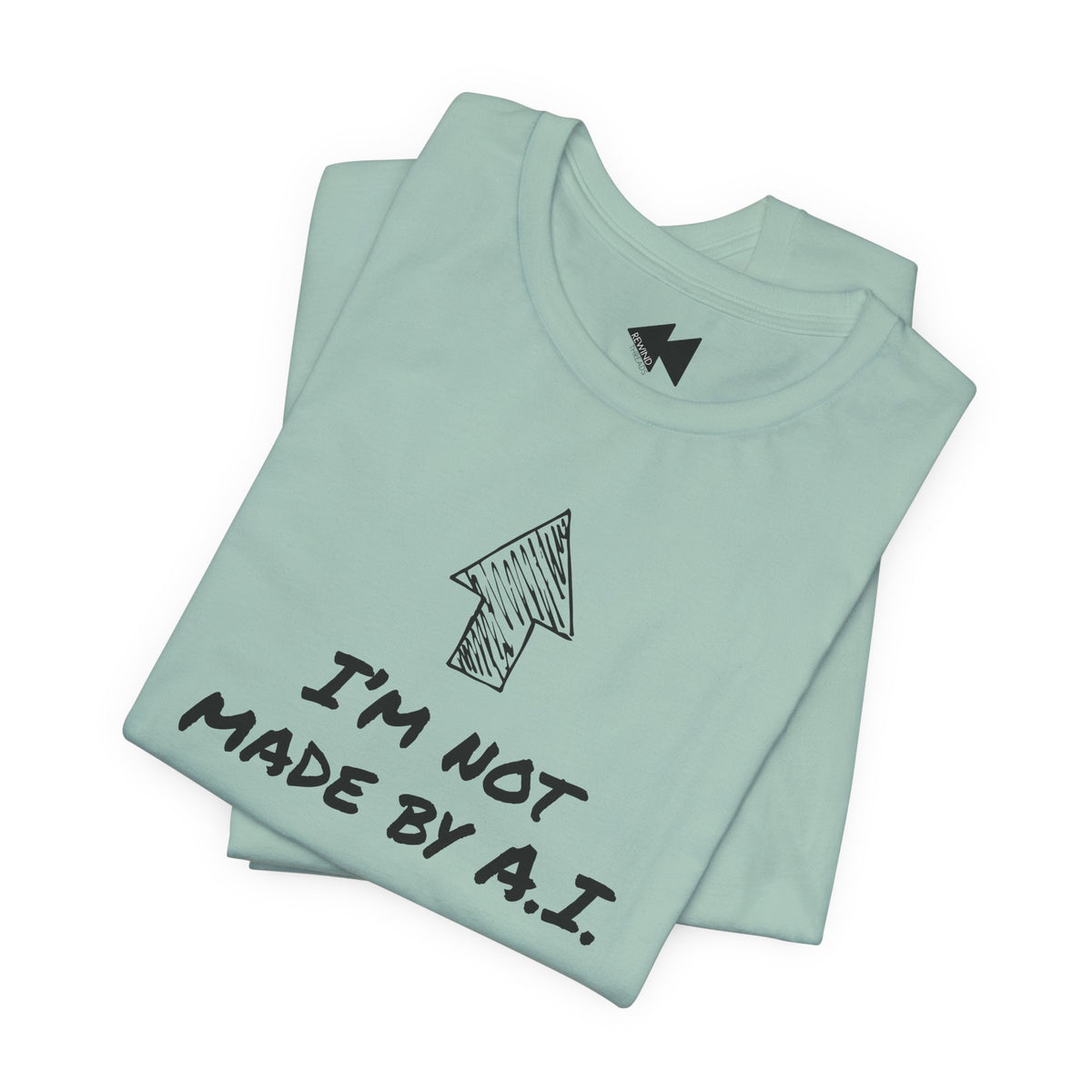 A folded teal short-sleeve t-shirt with a black graphic print featuring an arrow and the text 'I'M NOT MADE BY A.I.