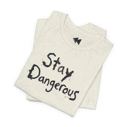 A folded Citron colored t-shirt with the words 'Stay Dangerous' printed in a black distressed brush font on the front, displayed on a clean white background.