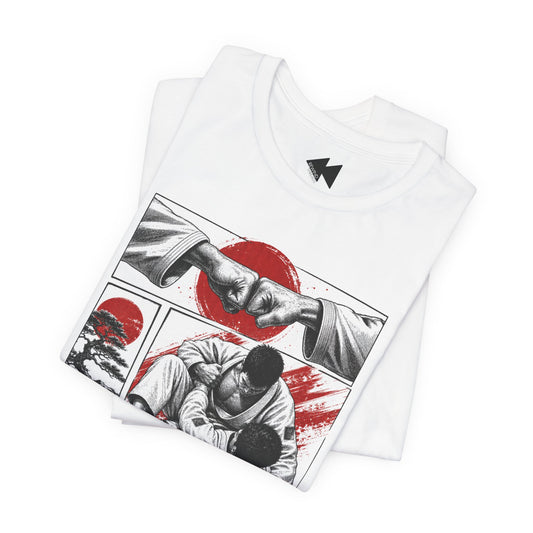 A folded white short-sleeve t-shirt with a black and red graphic print of martial arts, featuring a fist bump and a ground fight scene with a red circle motif. A black geometric logo is printed inside the collar.