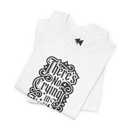 A folded white short-sleeve T-shirt with a black gothic-style graphic text print reading 'There's No Crying in JiuJitsu' on the front, displayed against a clean white background.