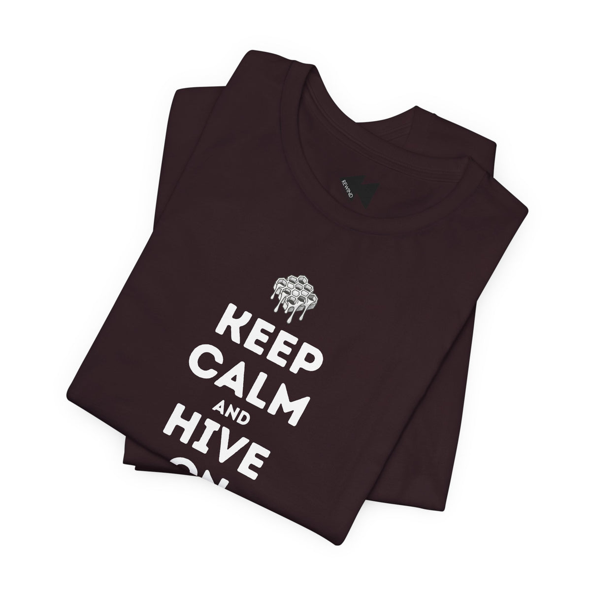 A folded dark brown t-shirt with a white graphic print that reads 'KEEP CALM AND HIVE ON' below a dripping bee design, displayed on a clean white background.