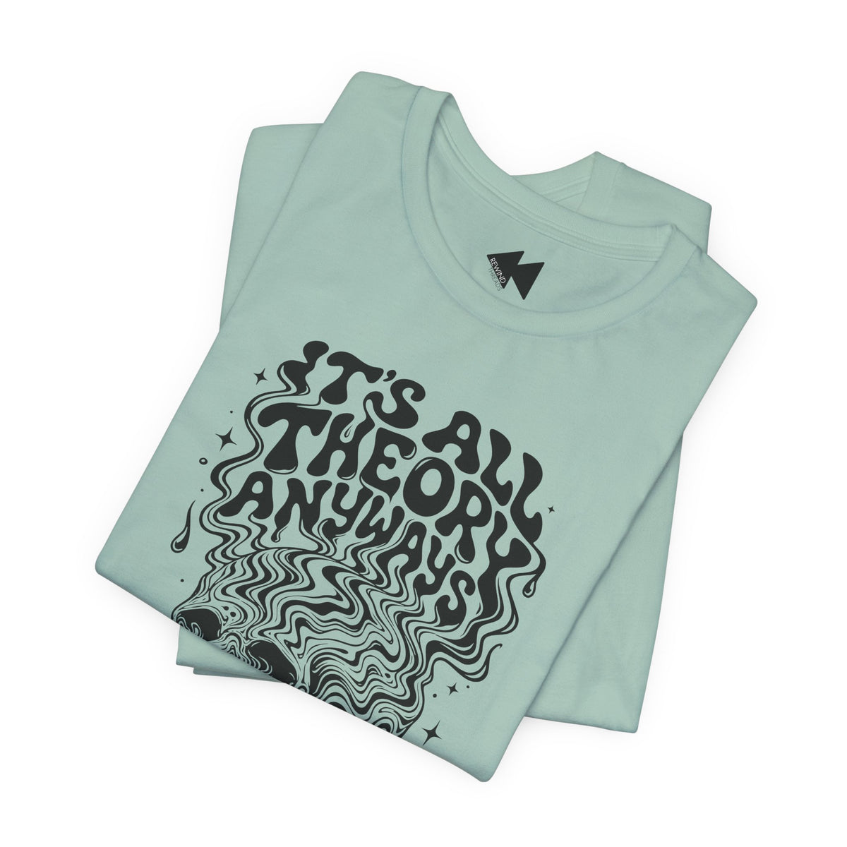 A folded mint green t-shirt with a black graphic print that reads 'IT'S ALL THEORY ANYWAYS' in a wavy, psychedelic font, displayed on a clean white background.