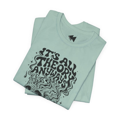 A folded mint green t-shirt with a black graphic print that reads 'IT'S ALL THEORY ANYWAYS' in a wavy, psychedelic font, displayed on a clean white background.