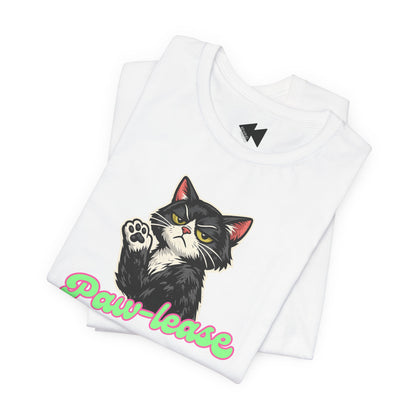 A folded white t-shirt featuring a graphic of a black and white cat with one paw raised, next to the text 'Paw-lease' in a pink and green gradient. The shirt is displayed on a clean white background.
