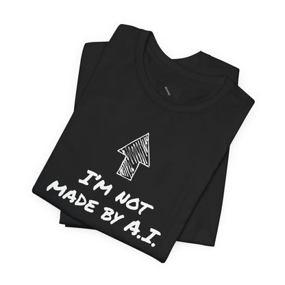 A folded black short-sleeve t-shirt with a white graphic print featuring an arrow and the text 'I'M NOT MADE BY A.I.