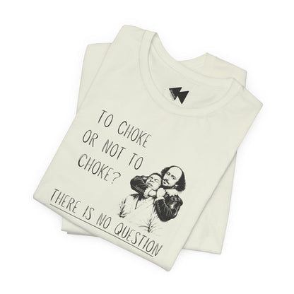 A folded light green graphic T-shirt on a plain white background. The shirt features a black printed illustration of Shakespeare and the text 'TO CHOKE OR NOT TO CHOKE? THERE IS NO QUESTION'.