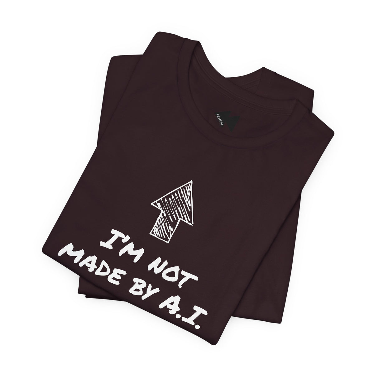 A folded maroon short-sleeve t-shirt with a black graphic print featuring an arrow and the text 'I'M NOT MADE BY A.I.
