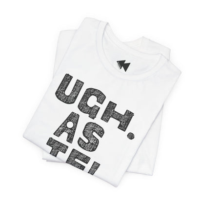 A folded white t-shirt with a black textured graphic reading 'UGH. AS IF'.