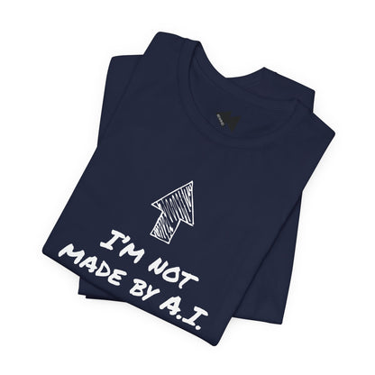 A folded navy blue short-sleeve t-shirt with a black graphic print featuring an arrow and the text 'I'M NOT MADE BY A.I.