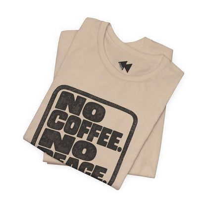 A folded beige t-shirt with a distressed black graphic that reads 'NO COFFEE. NO PEACE.' on a plain white background.