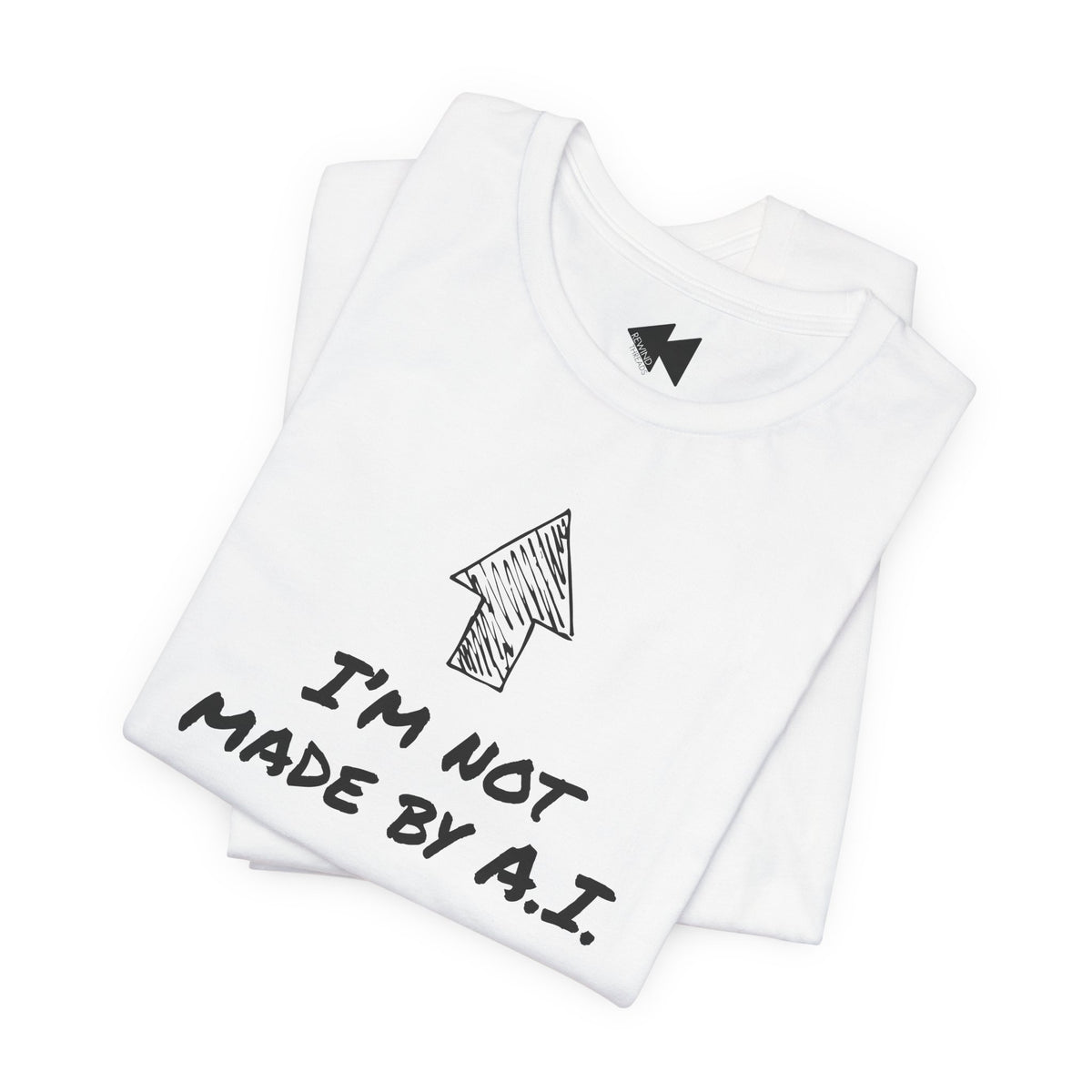 A folded white t-shirt with a black hand-drawn arrow graphic and the text 'I'M NOT MADE BY A.I.