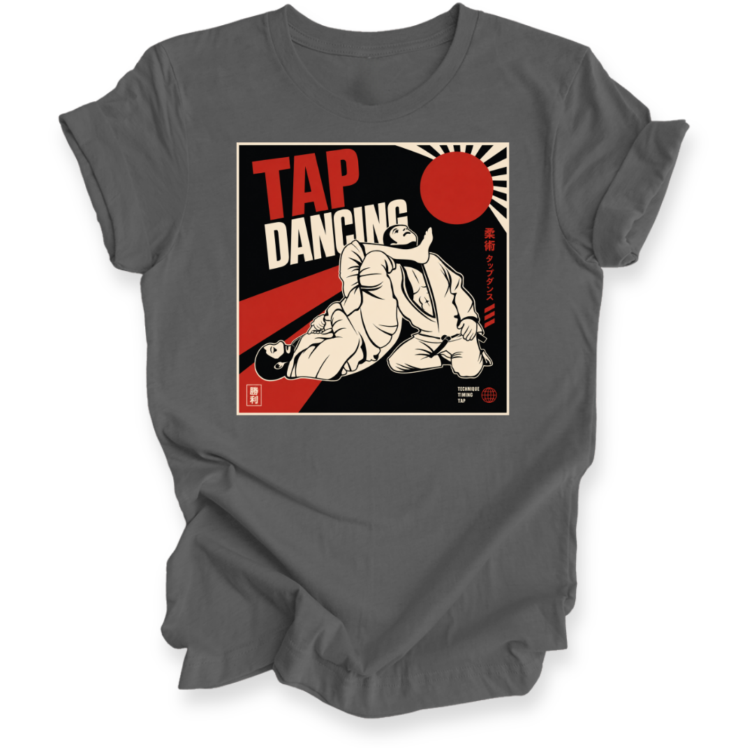 A dark gray short-sleeve crewneck t-shirt with a vintage-style graphic print on the chest reading 'TAP DANCING' in red and white, featuring an illustration of two BJJ fighters and a red rising sun.