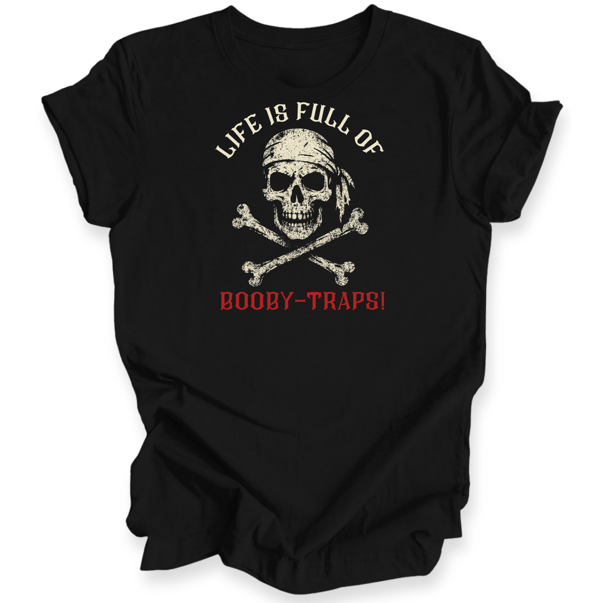 A black short-sleeve t-shirt with a distressed pirate-themed graphic on the front. The design features a skull wearing a bandana above crossed bones, with the text 'LIFE IS FULL OF' in white arched above and 'BOOBY-TRAPS!' in red below.