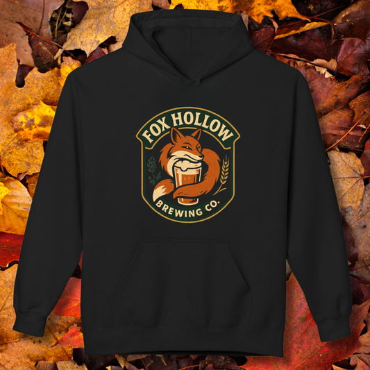 Black hoodie with Fox Hollow Brewing Co. logo on a background of autumn leaves