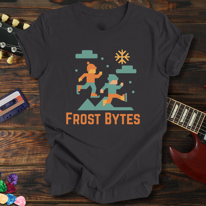 Black t-shirt with 'Frost Bytes' graphic design on a wooden surface with a guitar and cassette tape.