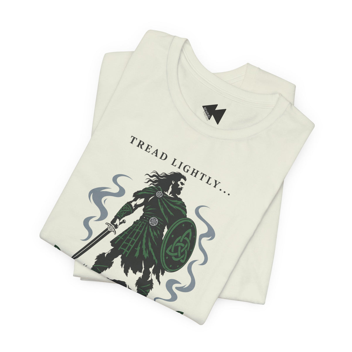 A folded citron crewneck t-shirt with a graphic print of a Irish tartan warrior holding a shield and sword, accompanied by the text 'Tread lightly I'm Irish".