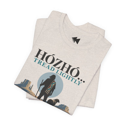 A folded light heather gray t-shirt with a graphic print that reads 'HÓZHÓ.