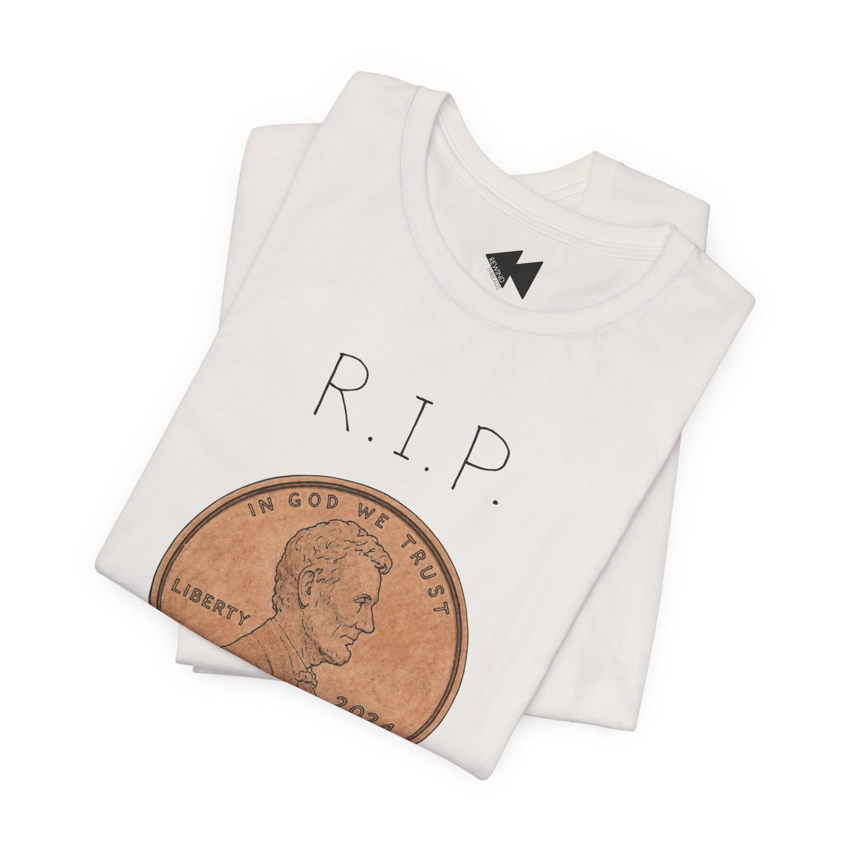 A folded white t-shirt featuring a graphic print of a penny with the text 'R.I.P'