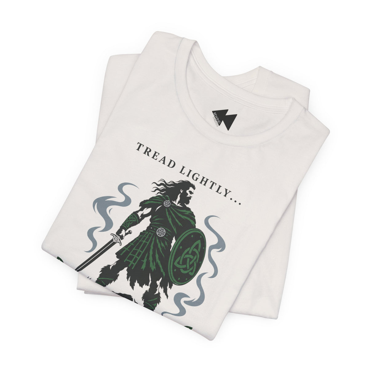 A vintage white folded crewneck t-shirt with a graphic print of a Irish tartan warrior holding a shield and sword, accompanied by the text 'Tread lightly I'm Irish".