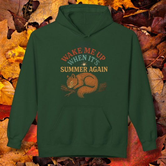 Green hoodie with a squirrel graphic and text on a background of autumn leaves