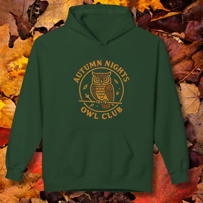 Green hoodie with 'Autumn Nights Owl Club' design on a background of autumn leaves.