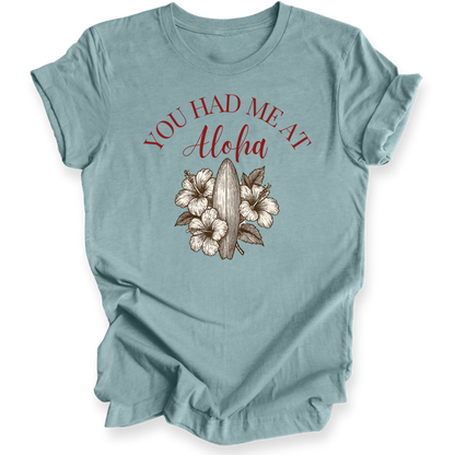 Light blue t-shirt with 'You Had Me at Aloha' text and floral design on a white background