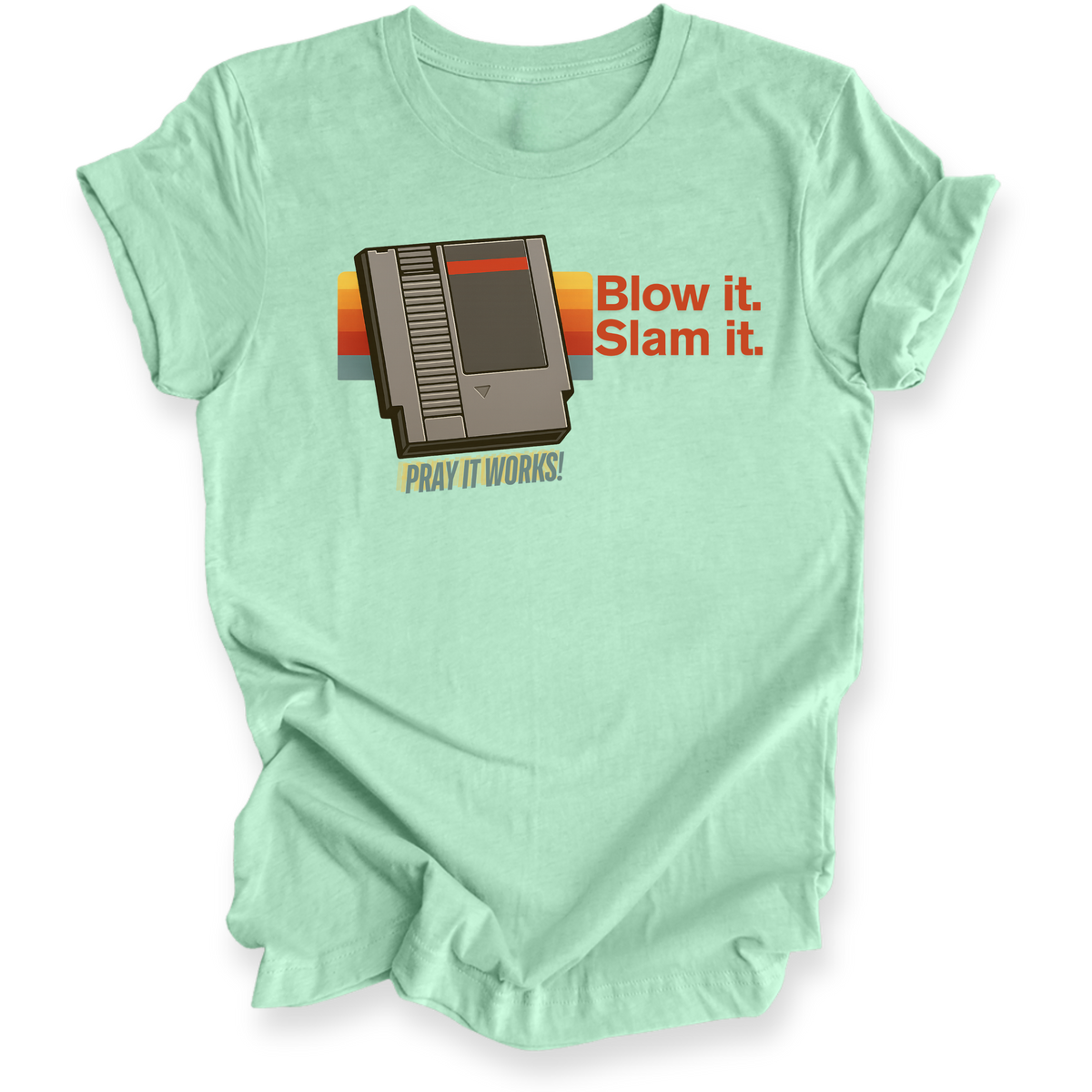 Light green t-shirt with retro gaming console graphic and text on a white background