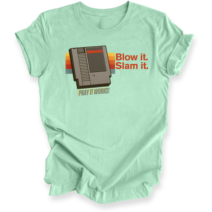 Light green t-shirt with retro gaming console graphic and text on a white background