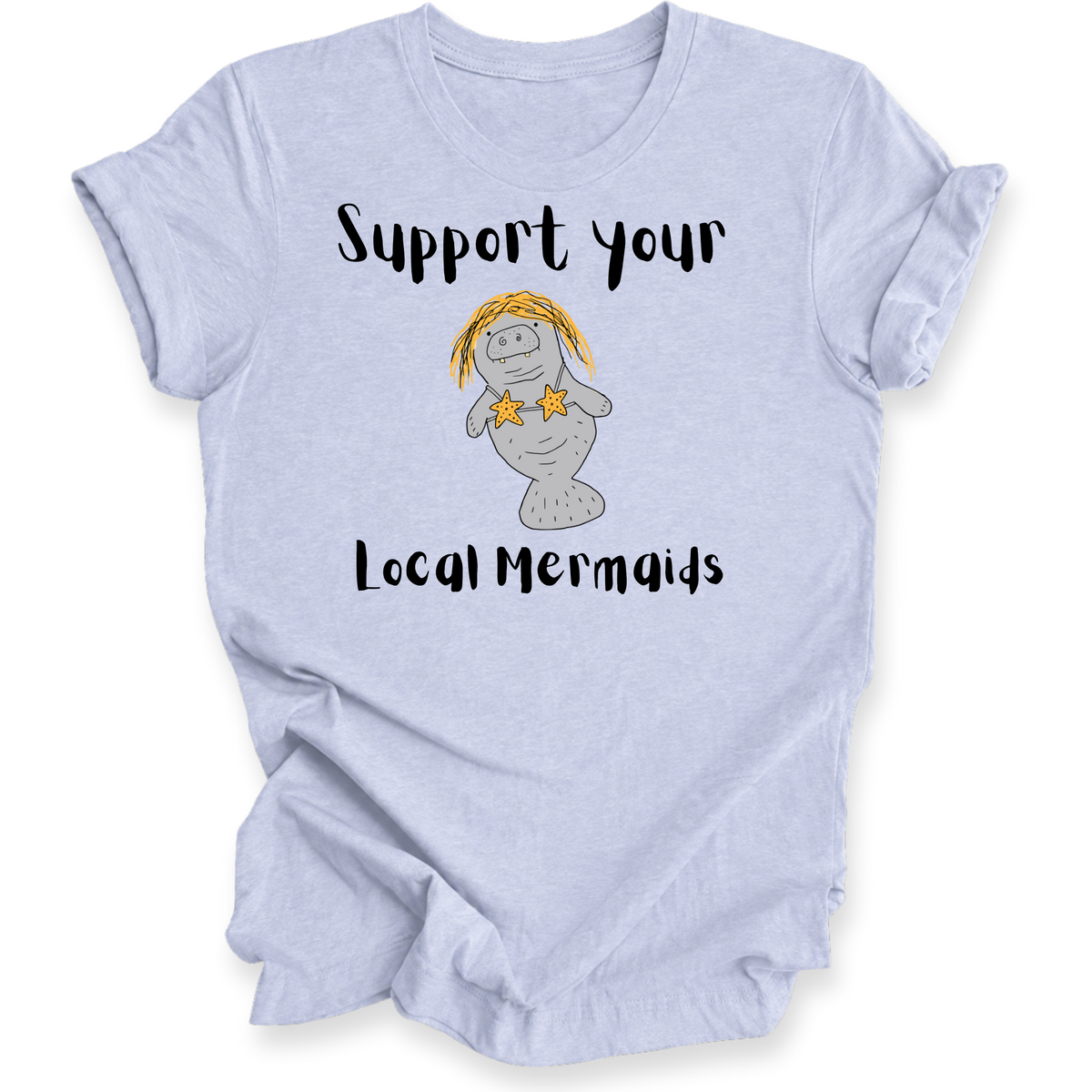 A light blue heather t-shirt with a graphic of a cartoon mermaid and the text 'Support your Local Mermaids' printed on the front, displayed on a clean white background.