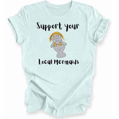 A light mint green graphic t-shirt featuring a cartoon mermaid with yellow hair and starfish accents, with the text 'Support your Local Mermaids' printed in black.