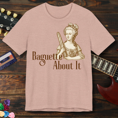 T-shirt with a graphic of a woman holding a baguette and text 'Baguette About It' on a wooden background.