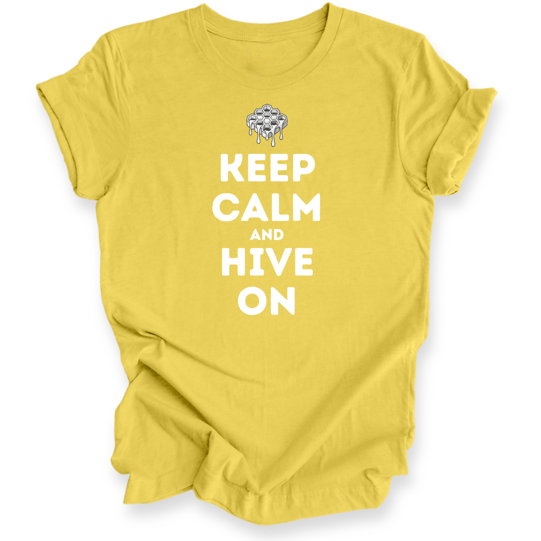 A yellow short-sleeve t-shirt with a white printed graphic that reads 'KEEP CALM AND HIVE ON' with a dripping bee hive illustration above the text, displayed on a clean white background.