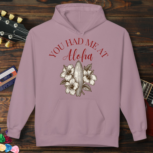 Purple hoodie with 'You Had Me At Aloha' text and floral design on a wooden background