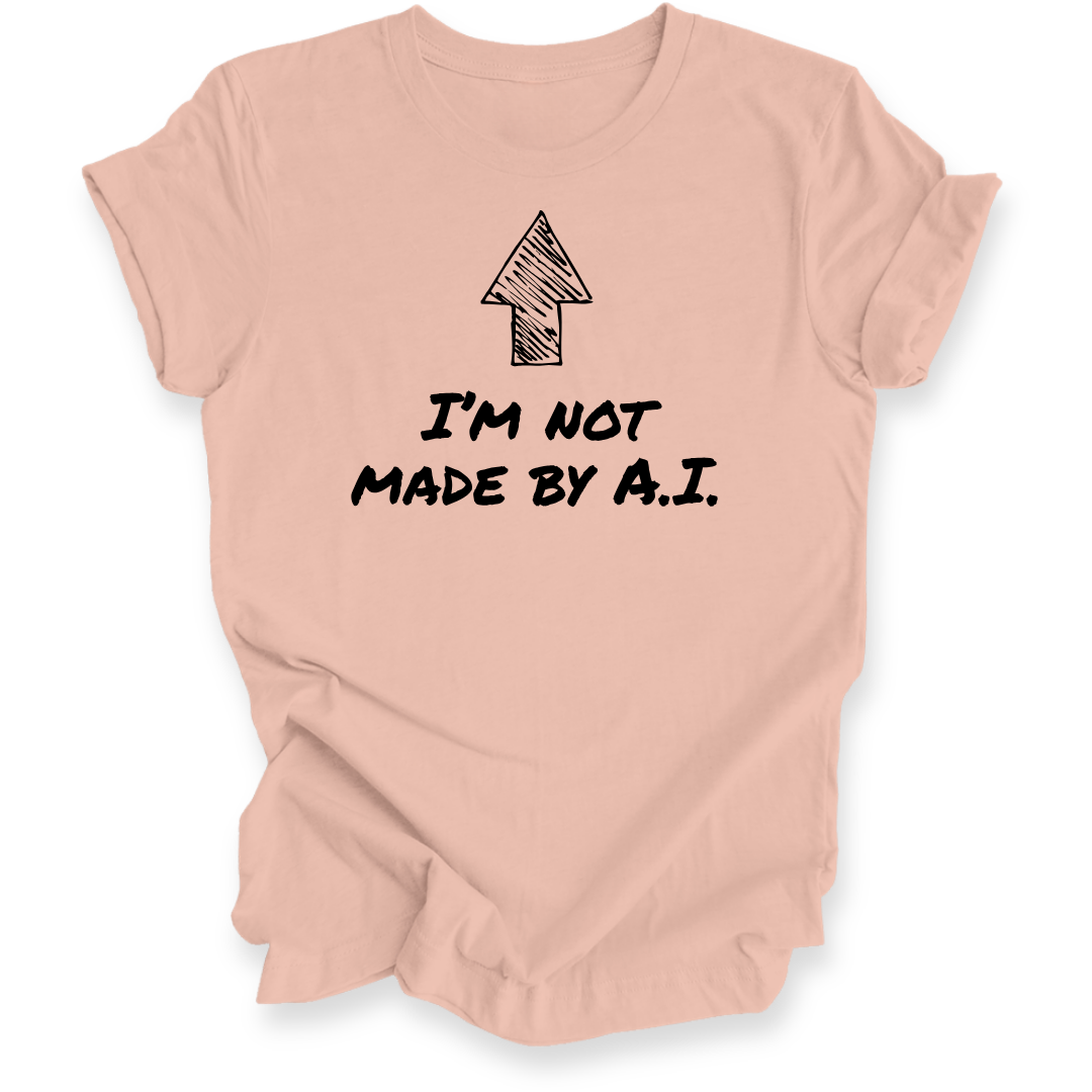 A peach-colored short-sleeve t-shirt with a black graphic of an arrow and the text 'I'M NOT MADE BY A.I.