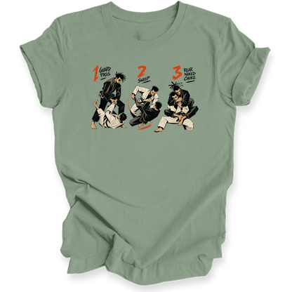 A sage green short-sleeve crewneck t-shirt featuring a graphic print of three martial arts figures in a sequence, labeled '1 Guard Pass', '2 SWEEP', and '3 REAR NAKED CHOKE' in orange and black text.