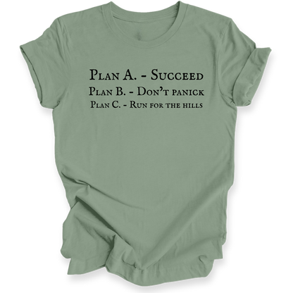 A sage green short-sleeve crewneck t-shirt with black printed text on the front reading 'PLAN A. - SUCCEED PLAN B. - DON'T PANICK PLAN C. RUN FOR THE HILLS'