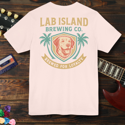 T-shirt with Lab Island Brewing Co. logo on a wooden surface with a guitar and cassette tape.