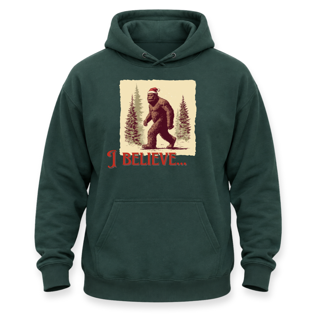 A dark green pullover hoodie with a front kangaroo pocket and a graphic print of Bigfoot wearing a Santa hat in a snowy forest, with the text 'I BELIEVE.