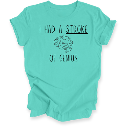 A mint green short-sleeve t-shirt with a black graphic print that reads 'I HAD A STROKE OF GENIUS' with a simple brain illustration in the center, displayed on a clean white background.