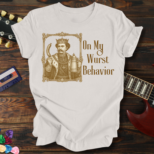 White t-shirt with graphic design and text on a wooden surface with a guitar and cassette tape.