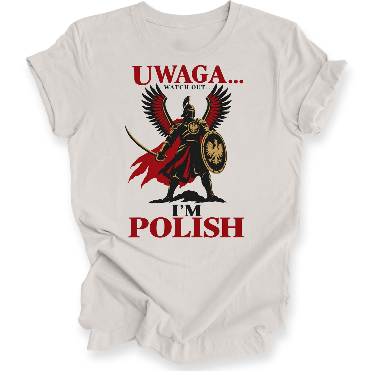 A light beige graphic t-shirt featuring a stylized Polish warrior with a red cape and eagle shield, with the text 'UWAGA.