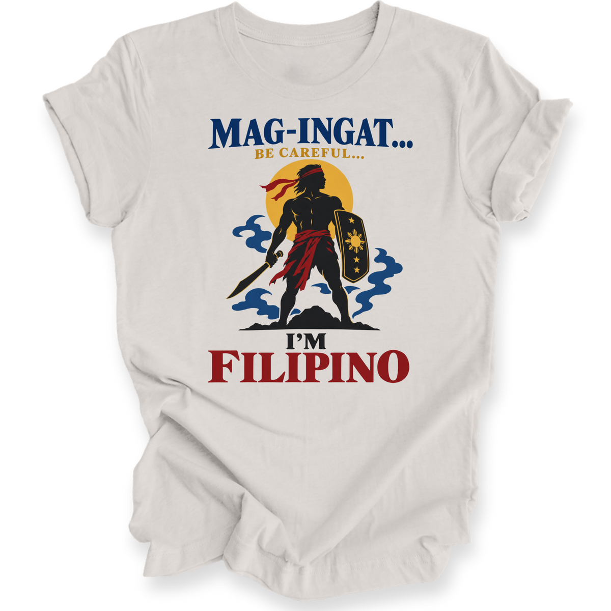 A light beige crewneck t-shirt with a graphic print of a Filipino warrior silhouette against a sunset, with the text 'MAG-INGAT.