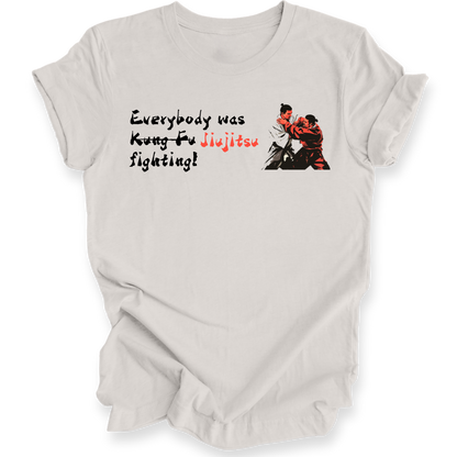 A light gray short-sleeve t-shirt with a graphic print on the front. The graphic features the text 'Everybody was Jiu-Jitsu fighting!' in black and red lettering, alongside an illustration of two martial artists in a grappling stance.