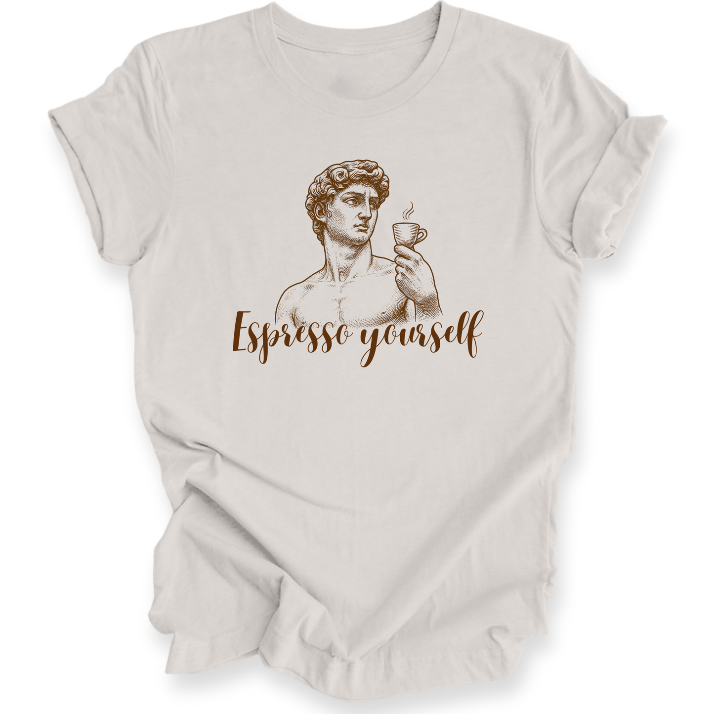 Beige t-shirt with a graphic of a classical statue holding a cup and the text 'Espresso yourself' on a white background.