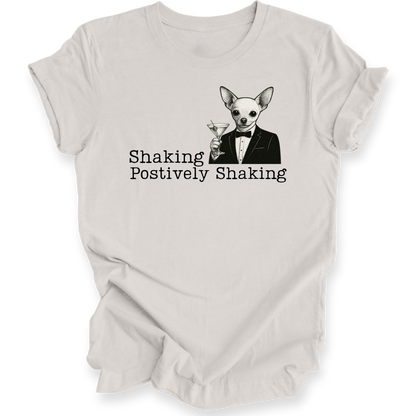 White t-shirt with a dog in a suit graphic and text 'Shaking Postively Shaking' on a white background